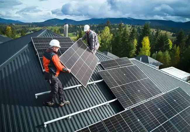 A completed solar carport over a supermarket car park with EV charging